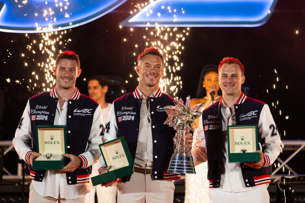 Kevin Estre, Andre Lotterer and Laurens Vanthoor (L to R) took Porsche's first top-class WEC title since 2017