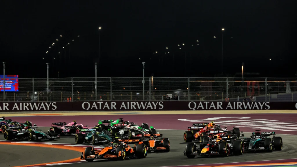 Lando Norris (GBR) McLaren MCL38 and Max Verstappen (NLD) Red Bull Racing RB20 lead at the start of the race. 01.12.2024. Formula 1 World Championship, Rd 23, Qatar Grand Prix, Doha, Qatar, Race Day